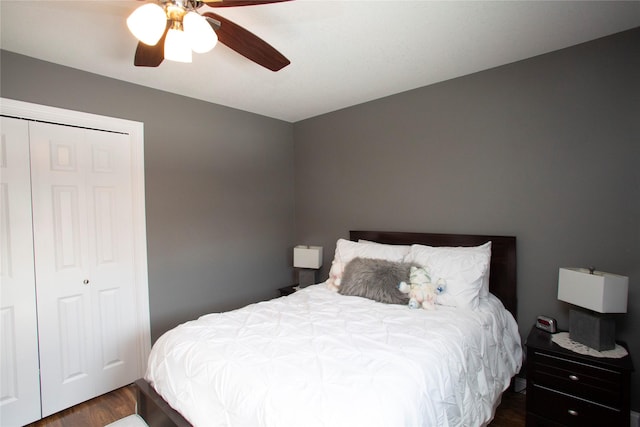 bedroom with ceiling fan and dark hardwood / wood-style flooring