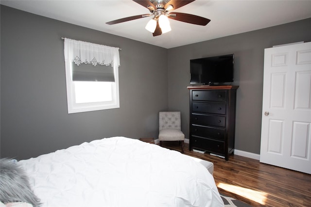 bedroom featuring dark hardwood / wood-style floors and ceiling fan