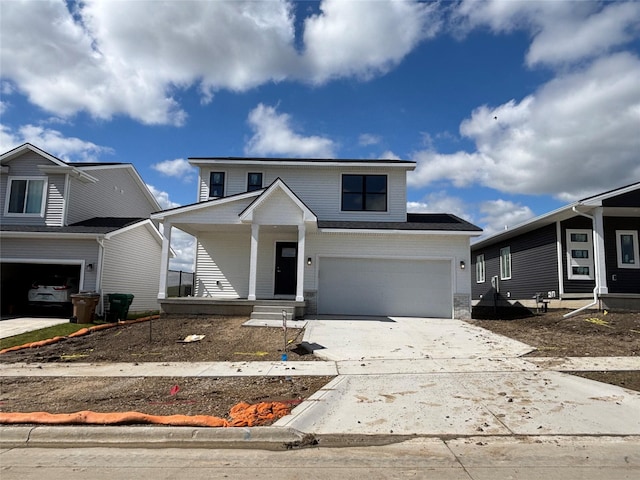 1715 Gordon Ct, Norwalk, IA 50211 - traditional-style house featuring driveway, an attached garage, and a porch