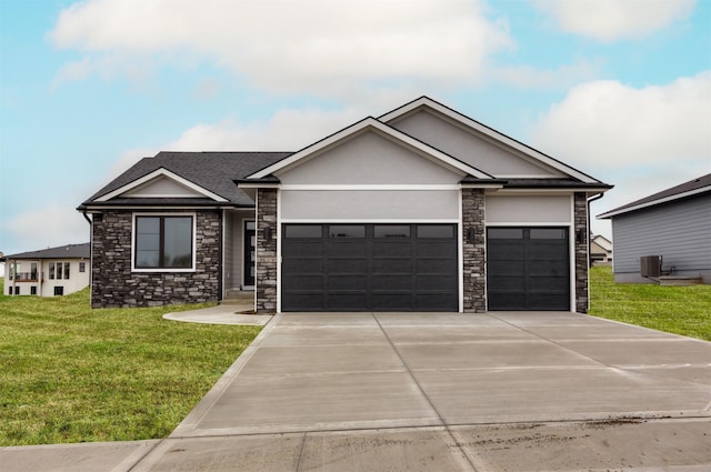 18258 Hidden Knl, Clive, IA 50325 - view of front of home featuring stone siding, a garage, concrete driveway, a front lawn, and stucco siding