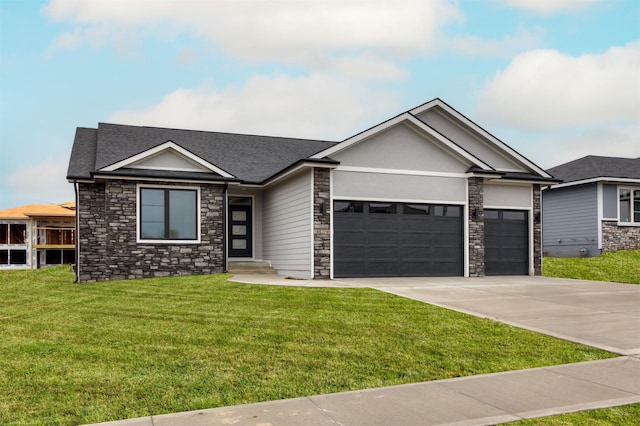 18258 Hidden Knl, Clive, IA 50325 - view of front of property with stone siding, an attached garage, driveway, a front lawn, and roof with shingles