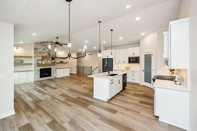 18258 Hidden Knl, Clive, IA 50325 - kitchen featuring black appliances, a sink, lofted ceiling, ceiling fan, and light countertops