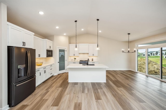 18258 Hidden Knl, Clive, IA 50325 - kitchen with black appliances, a sink, light countertops, tasteful backsplash, and white cabinetry