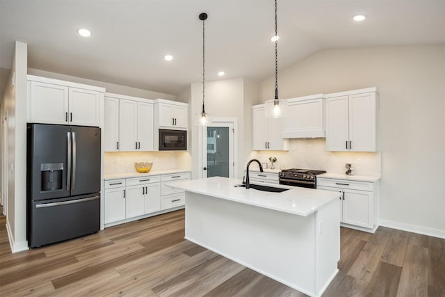 18258 Hidden Knl, Clive, IA 50325 - kitchen featuring refrigerator with ice dispenser, a sink, gas range oven, black microwave, and tasteful backsplash