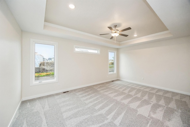 18258 Hidden Knl, Clive, IA 50325 - empty room with a tray ceiling, light colored carpet, ceiling fan, baseboards, and recessed lighting