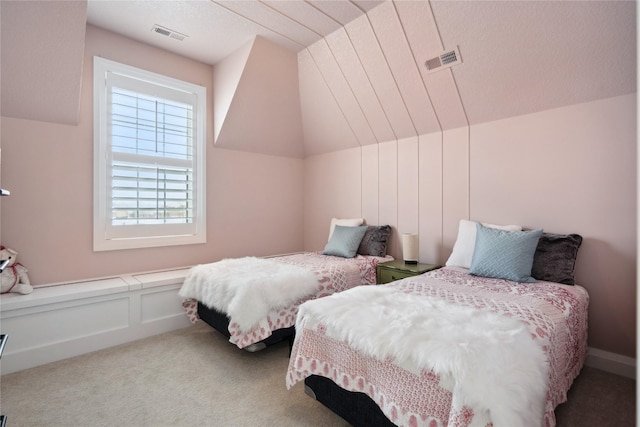 bedroom featuring light carpet and lofted ceiling