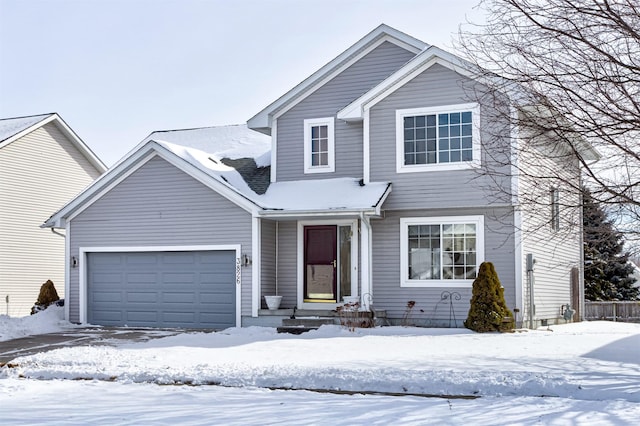 front of property with a garage