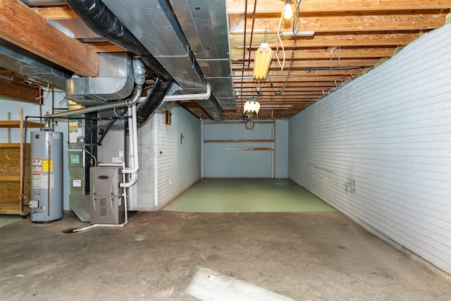 basement with brick wall, water heater, and heating unit