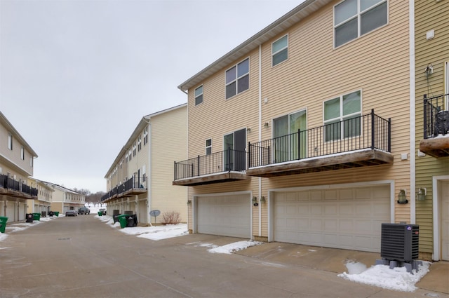 rear view of property featuring central AC