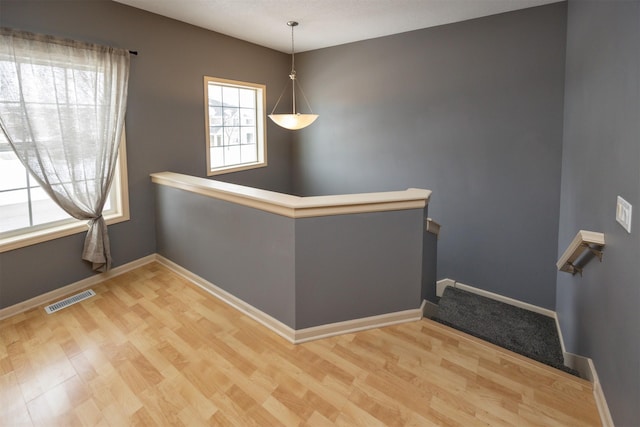 unfurnished room featuring light wood-type flooring