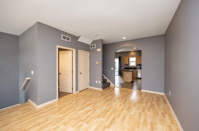 unfurnished living room featuring light hardwood / wood-style floors