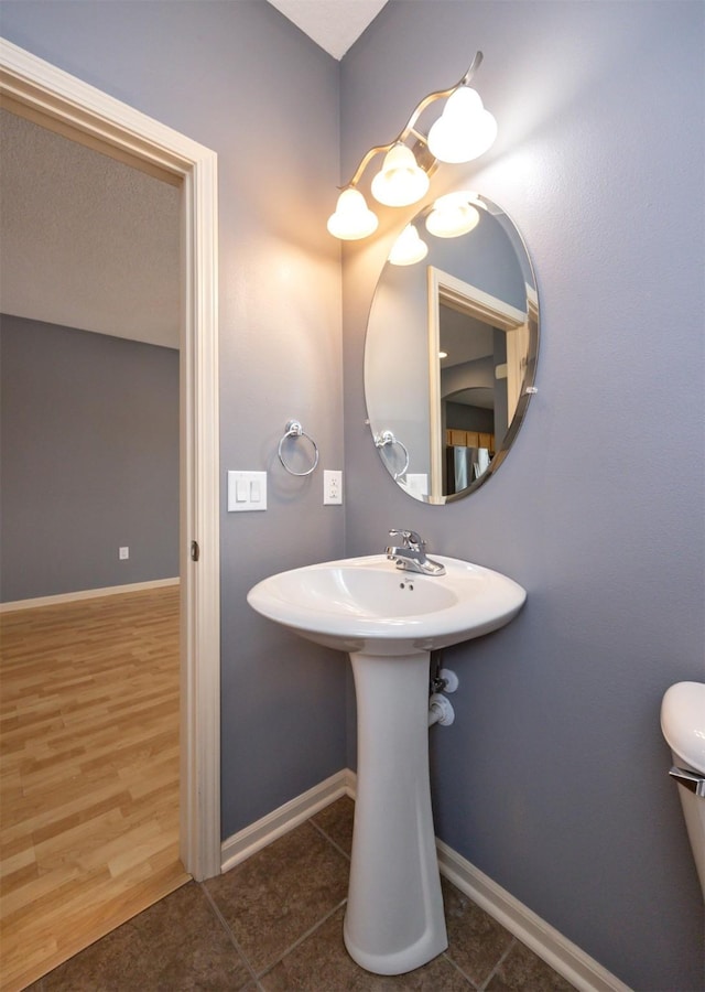 bathroom with sink and wood-type flooring