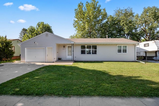 ranch-style home with a front yard and a garage