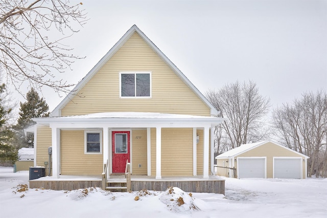 view of front of home with central air condition unit, a porch, an outdoor structure, and a garage