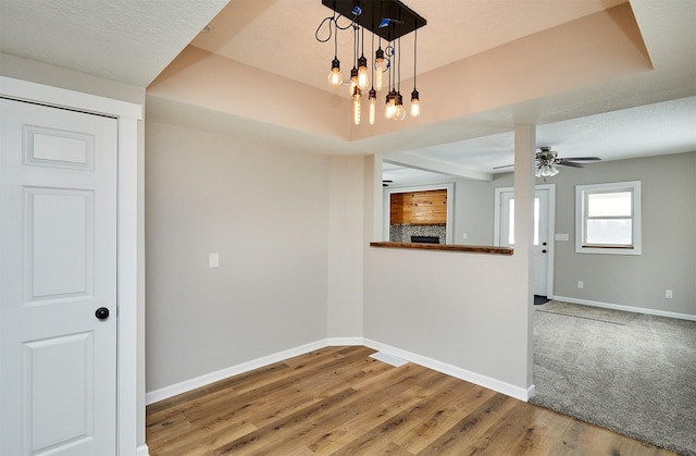 empty room with hardwood / wood-style flooring and ceiling fan