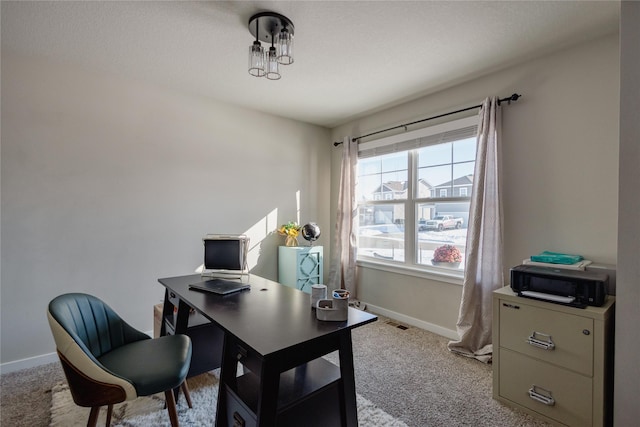 home office with light colored carpet