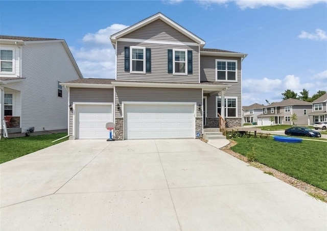 view of front facade featuring a front lawn and a garage