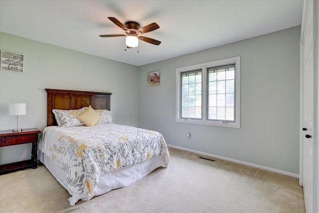 carpeted bedroom featuring ceiling fan