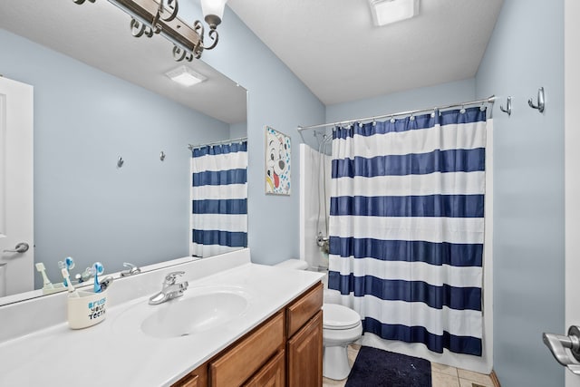 bathroom with tile patterned floors, toilet, vanity, and a shower with shower curtain