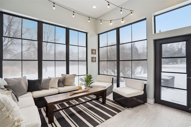 living room featuring a towering ceiling