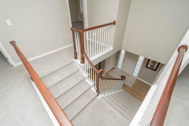 stairway featuring hardwood / wood-style flooring