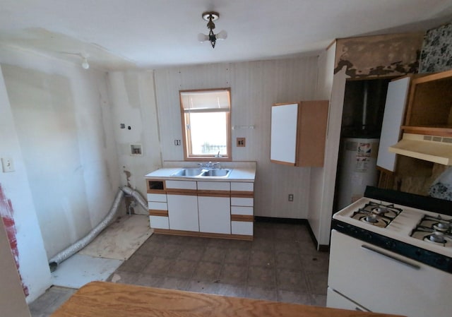 kitchen featuring sink, extractor fan, white cabinetry, gas water heater, and gas range gas stove