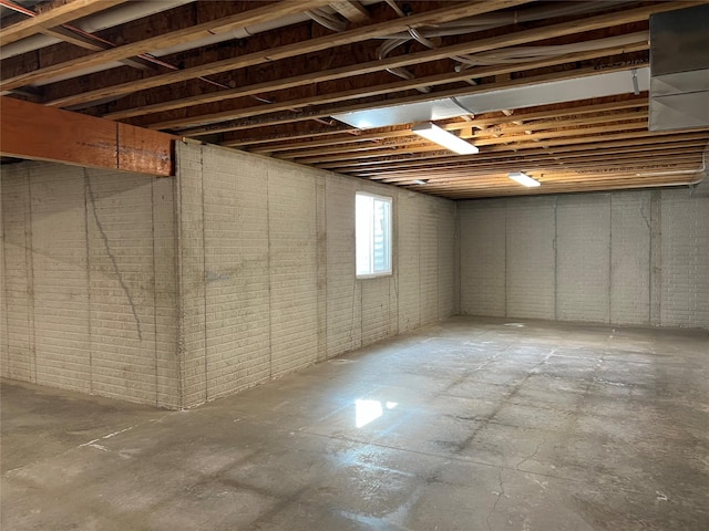 basement with brick wall