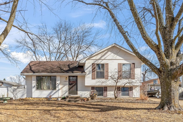 split level home featuring a front lawn