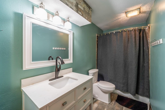 bathroom with vanity, a shower with curtain, toilet, and a textured ceiling