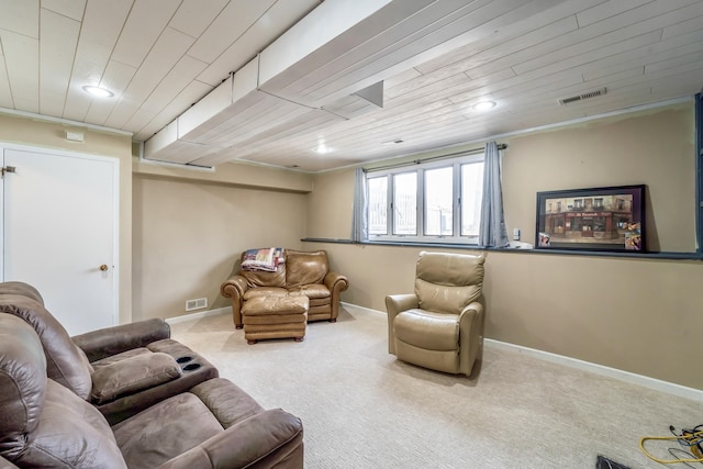 carpeted living room with wooden ceiling