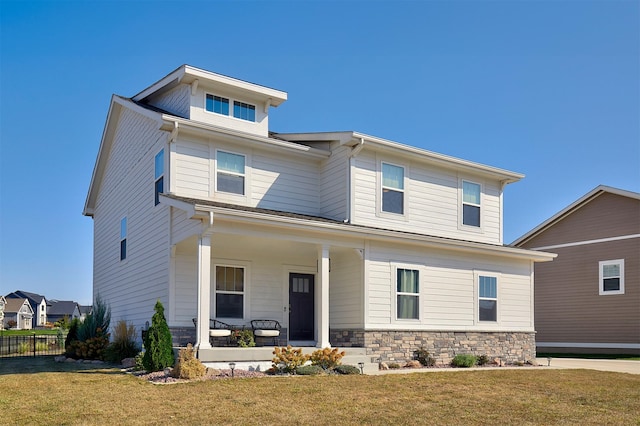 view of front of house featuring a front yard and a porch