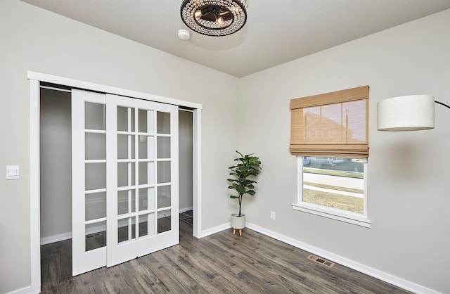 spare room with dark hardwood / wood-style floors