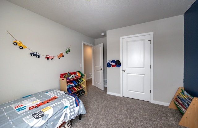 bedroom with baseboards and carpet flooring