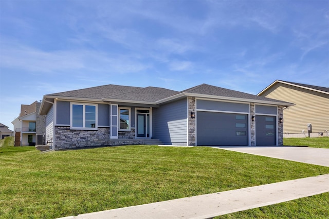 18274 Hidden Knl, Clive, IA 50325 - view of front facade featuring stone siding, a garage, concrete driveway, and a front lawn