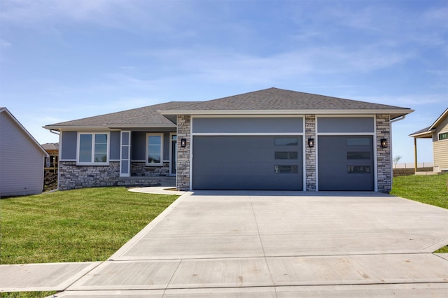 18274 Hidden Knl, Clive, IA 50325 - prairie-style home featuring concrete driveway, a garage, a front yard, roof with shingles, and stone siding