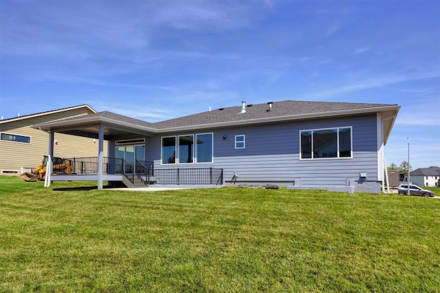 18274 Hidden Knl, Clive, IA 50325 - back of house featuring a lawn and a shingled roof