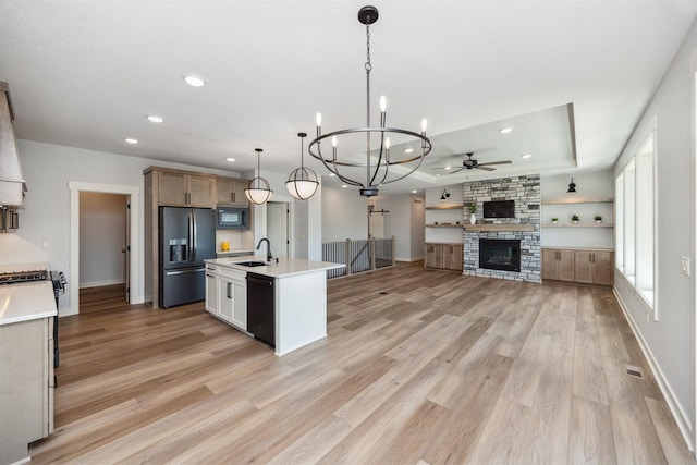 18274 Hidden Knl, Clive, IA 50325 - kitchen featuring black appliances, a ceiling fan, a raised ceiling, a sink, and recessed lighting