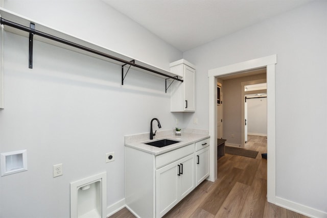 18274 Hidden Knl, Clive, IA 50325 - laundry area with electric dryer hookup, cabinet space, light wood-type flooring, baseboards, and hookup for a washing machine