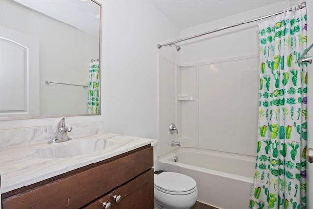 bathroom featuring toilet, vanity, and shower / tub combo with curtain