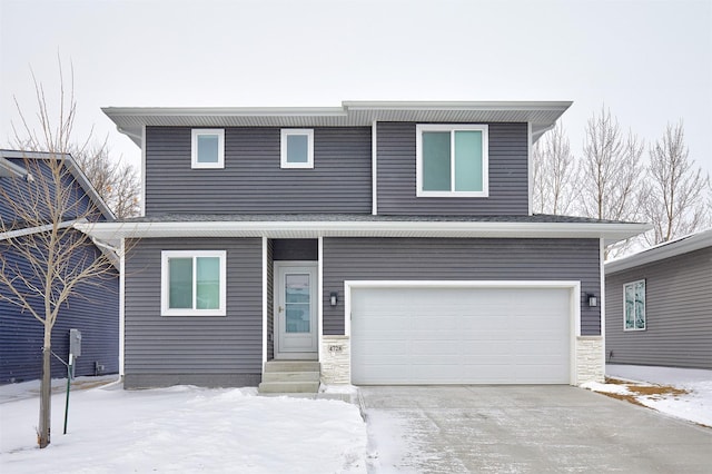 traditional home with concrete driveway and a garage