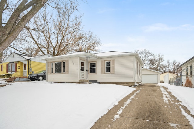 view of front of home featuring an outdoor structure and a garage