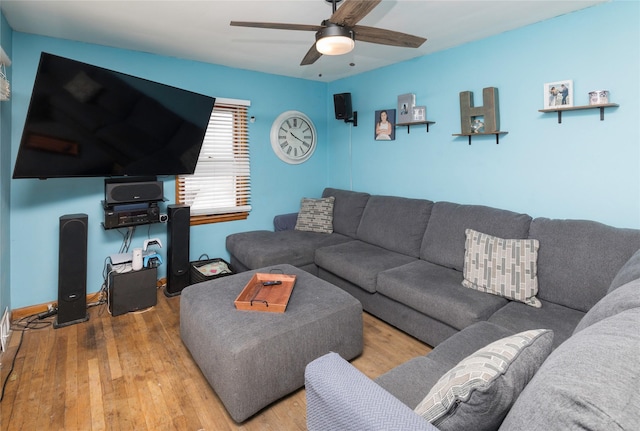 living area featuring ceiling fan and hardwood / wood-style floors