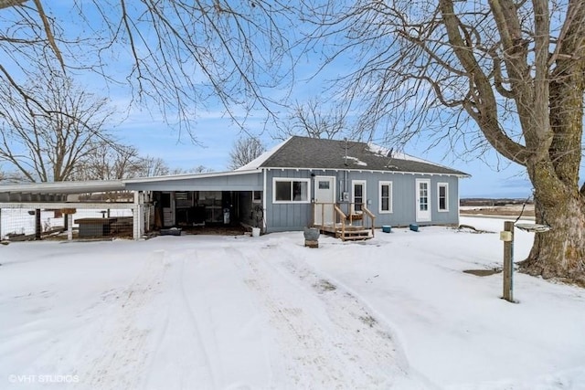 view of front of house featuring a carport and board and batten siding