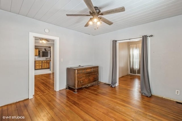 unfurnished room with ceiling fan, visible vents, wooden ceiling, and light wood-style flooring