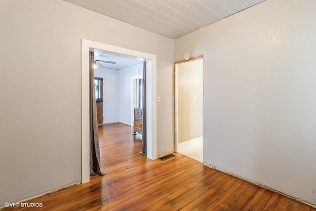 hall with wood finished floors