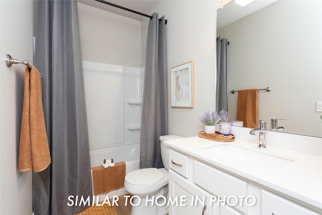 full bath featuring shower / bath combo, vanity, and toilet