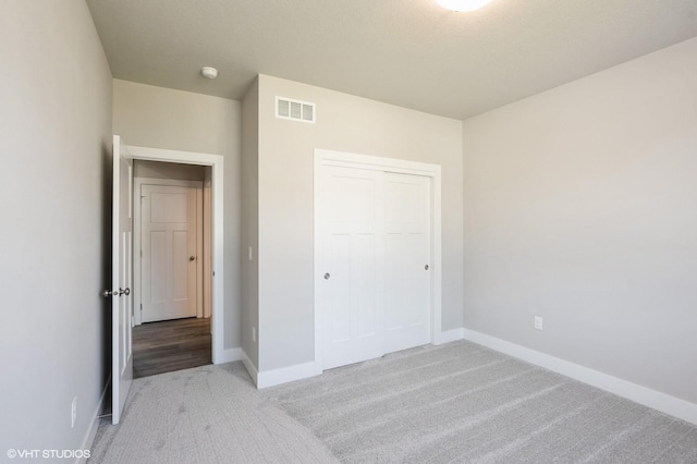 1020 2nd St NE, Altoona, IA 50009 - unfurnished bedroom featuring light colored carpet and a closet