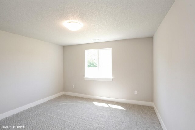 1020 2nd St NE, Altoona, IA 50009 - empty room with light carpet and a textured ceiling