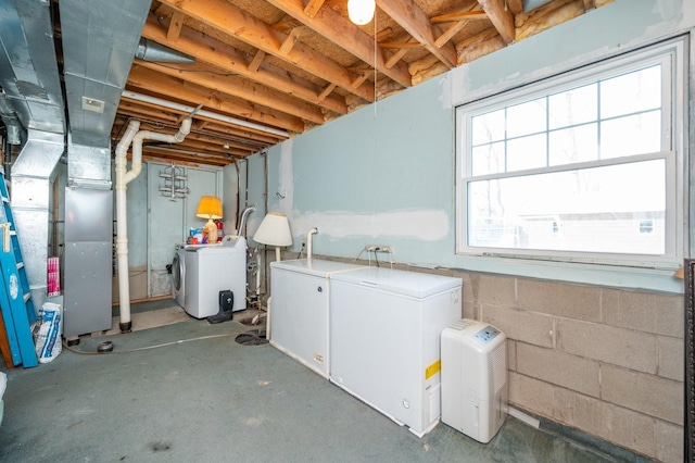 below grade area featuring independent washer and dryer and fridge