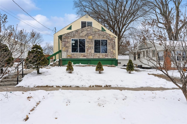 view of front of home featuring stone siding